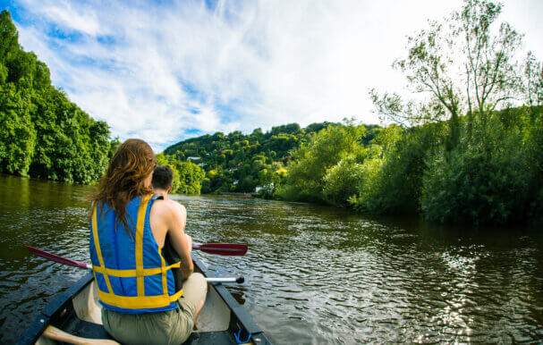 Two people canoeing along the river wye.